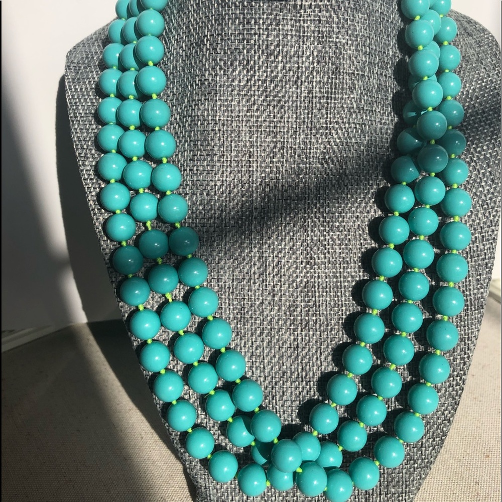 Turquoise color beaded 24 inch necklace with green string